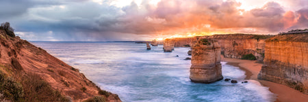 Shaun Trainer Fine Art Landscape Photography Prints. the twelve apostles sunset with a storm on the horizon.